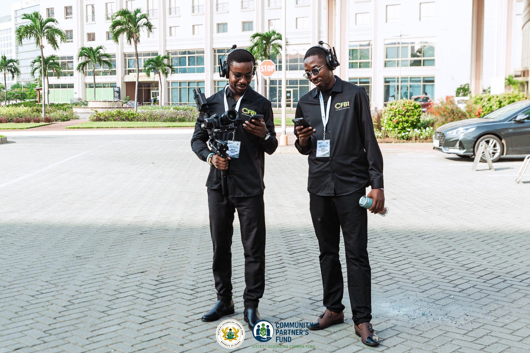 Two production crew members working together on location