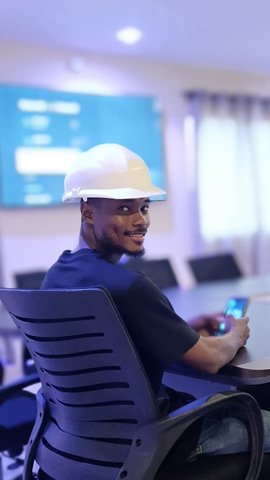 Technology team member in a hard hat during a technical briefing
